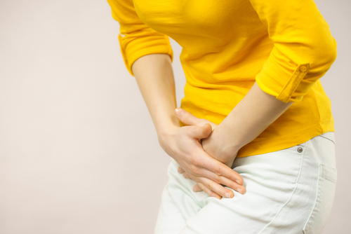 woman holding her hands over her bladder-img-blog